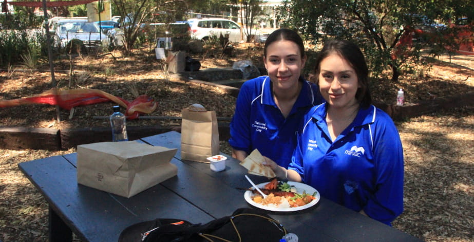 Two Mirvac employees eating lunch at national community day