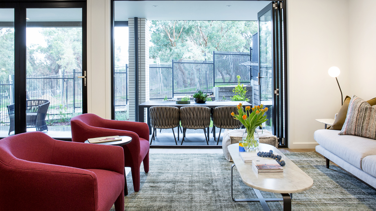 Living room with pink arm chairs
