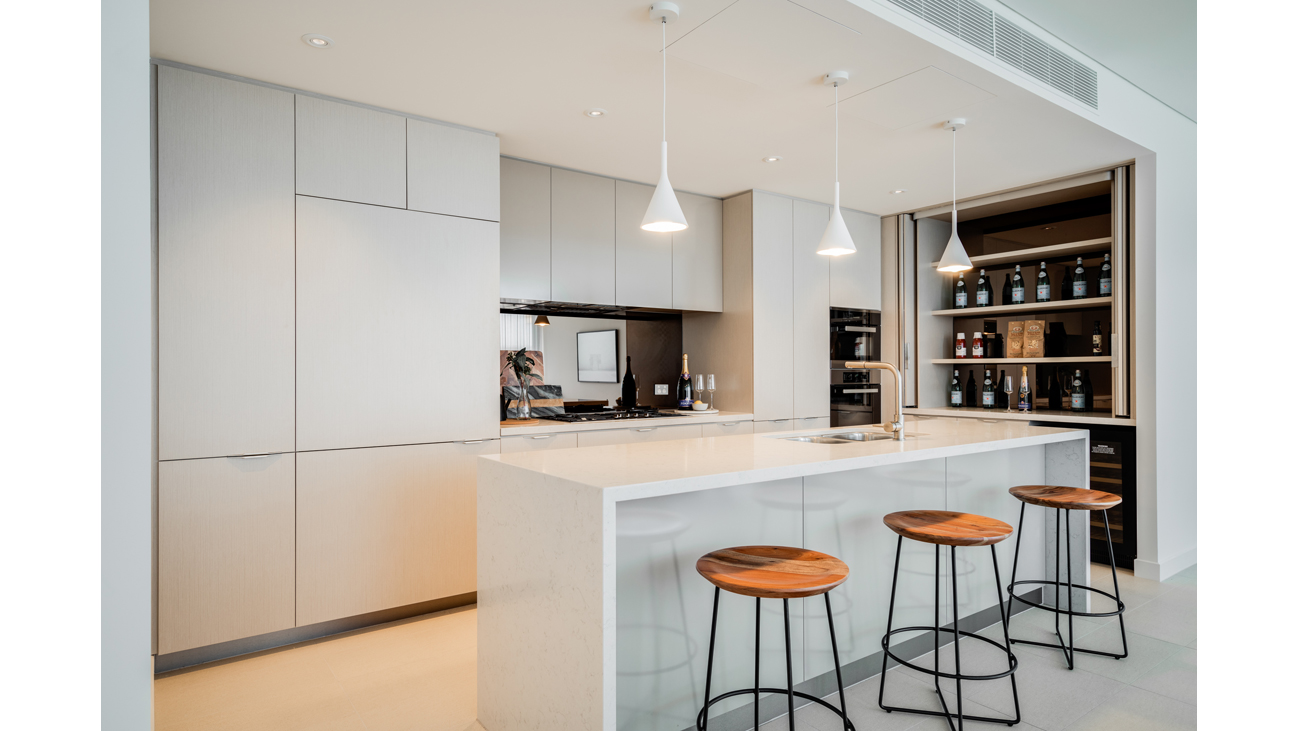 Galley kitchen with bar stools