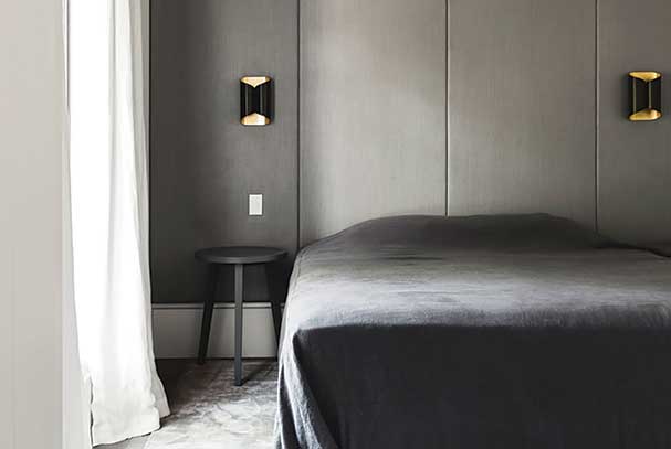 Dark bedroom utilising different fabrics and textures