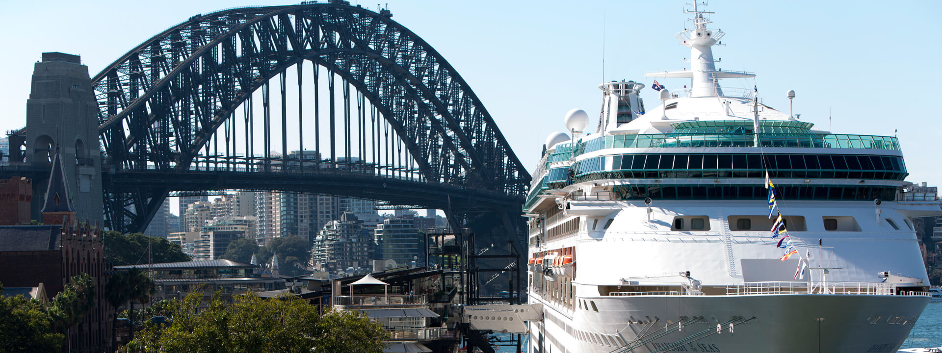 ferry in front of the Harbour Bridge in Sydney